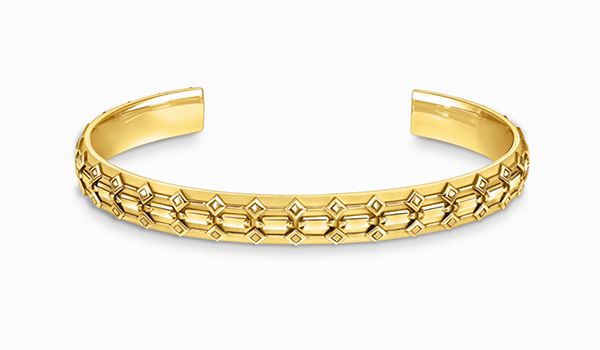 Yellow-gold wide bangle with crocodile detailing