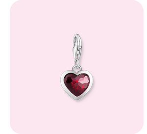 Silver charm pendant with red stone in heart-shape