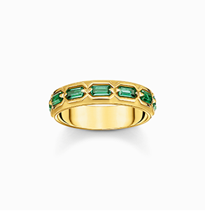 Gold plated ring in crocodile design with green stones