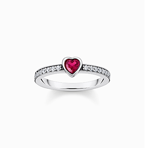 Silver solitaire ring with red heart-shaped stone