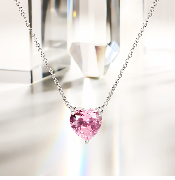 Silver necklace with pink heart-shaped pendant
