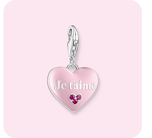 Silver charm pendant with pink heart