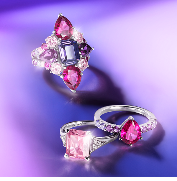 Silver cocktail ring with red, pink and violet zirconia stones